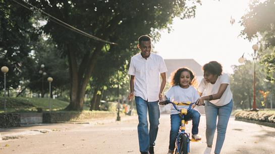 Parents with child on a bike