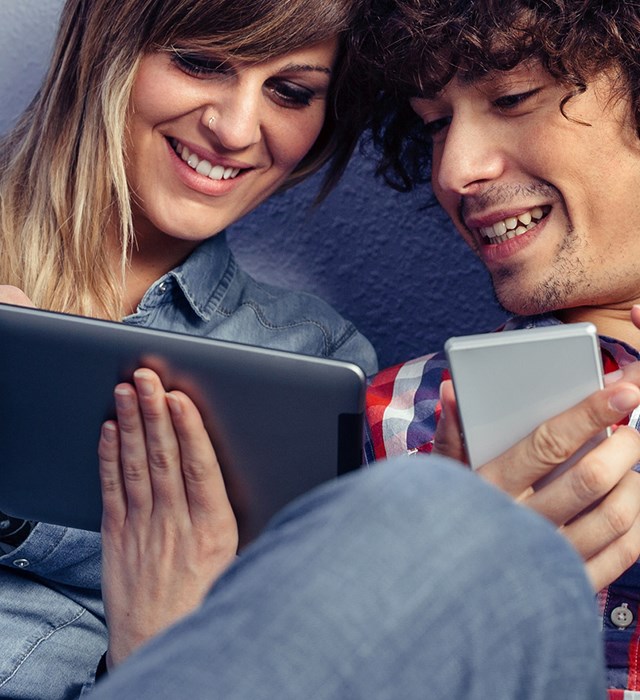 Young couple looking at a tablet