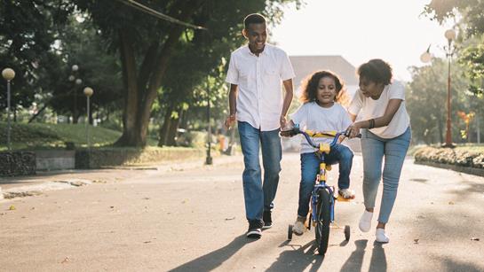 Parents With Child On Bike