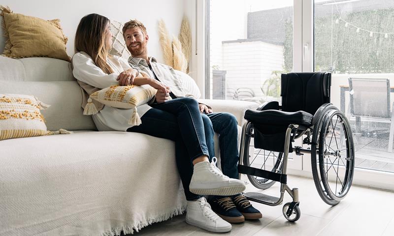 Couple At Home With Wheelchair