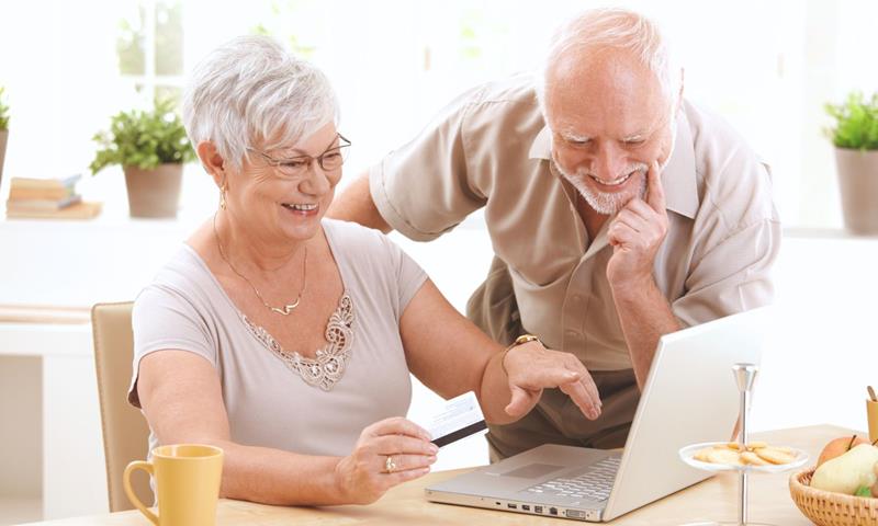 Older People On Computer At Home